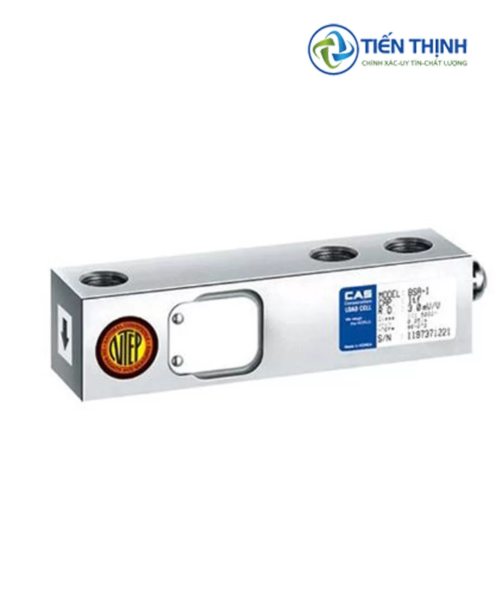 Cảm biến tải trọng hình hộp chữ nhật màu bạc, có bốn lỗ tròn.
