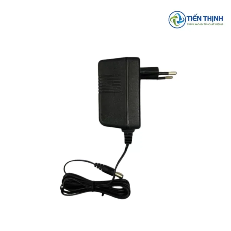 Adapter nguồn điện màu đen, chân cắm tròn, dùng cho các thiết bị điện tử.